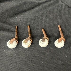 Set of 4 Vintage white ceramic Casters